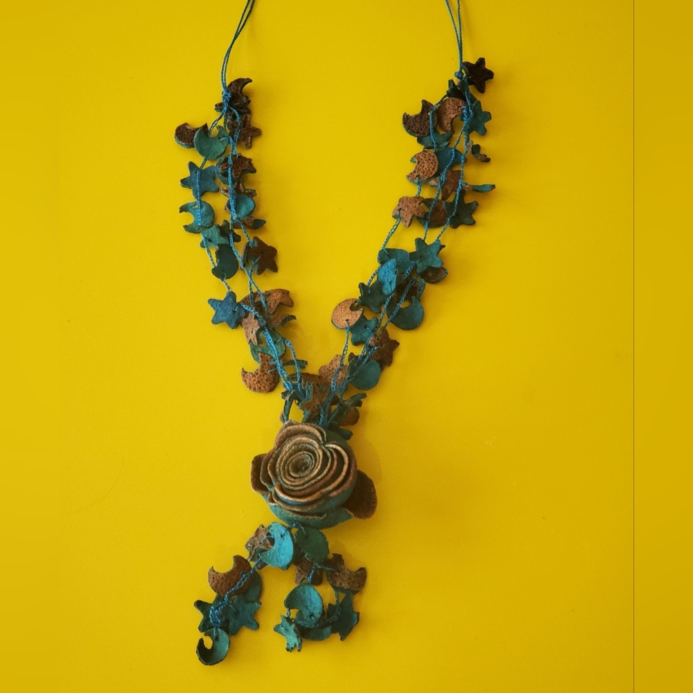 Handmade blue jewelry necklace from dried orange peals